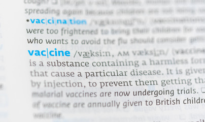 Fototapeta premium Definition of the word vaccine on a dictionary page