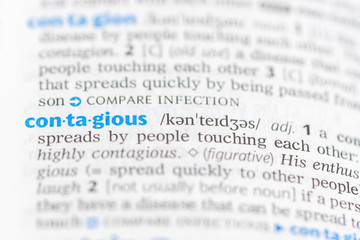 Definition of the word contagious on a dictionary page