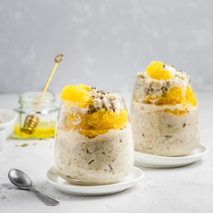 Overnight oatmeal breakfast in glasses. Slective focus, copy space.