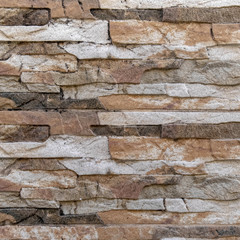 hand cut stone wall close up, rough texture pattern background