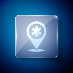 White Medical map pointer with cross hospital icon isolated on blue background. Square glass panels. Vector Illustration.