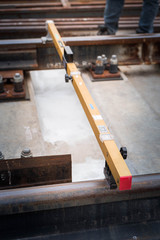 Engineer inspection on railway equipment with measurement tools