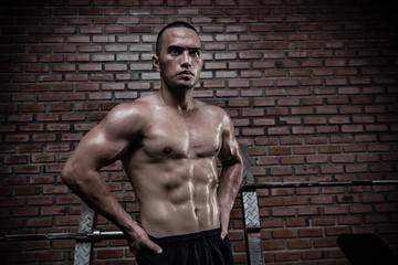 Fototapeta premium Portrait of asian man big muscle at the gym,Thailand people,Workout for good healthy,Body weight training,Fitness at the gym concept