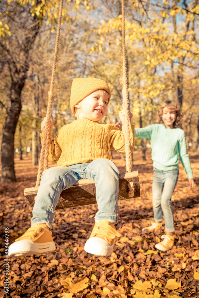 Poster Happy children having fun outdoor in autumn park