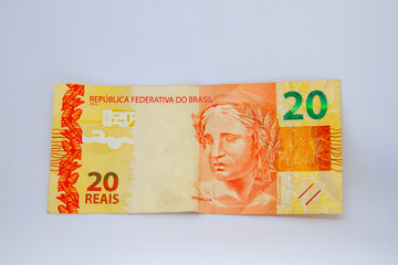 twenty reais banknote (Brazilian currency) on a white background