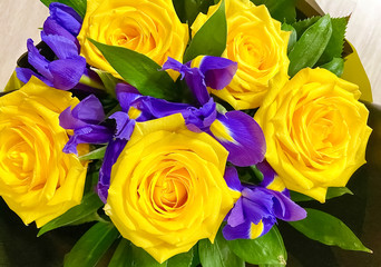 magnificent bouquet of iris flowers and yellow roses. Close-up