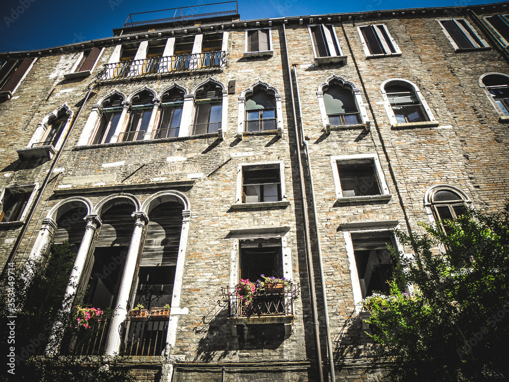 Wall mural arched windows of a building in venice,italy