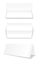 Realistic bifold paper brochures on white background with soft shadows. White booklet template. Business card design or flyer mock-up. Vector illustration.