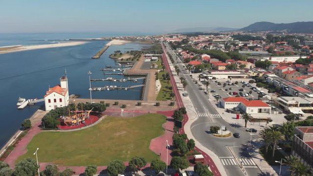 DRONE AERIAL FOOTAGE - Palm trees promenade and cycle path, Esposende, The marginal riverside, along the mouth of the Cavado River in Esposende, Portugal.