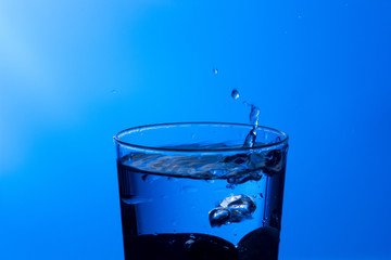 water falling into a clear glass