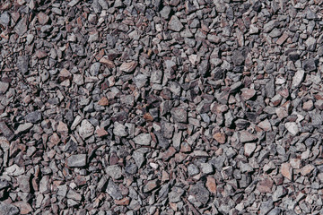 Background and texture of fine gray-pink granite rubble.