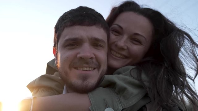 Positive successful couple in nature. The guy and the girl have fun close up