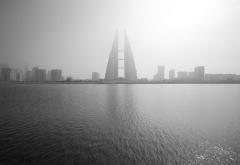 The Bahrain World Trade Center during a foggy day. The iconic building is the first skyscraper in the world to have wind turbines, December 29, 2017, Manama, Bahrain.