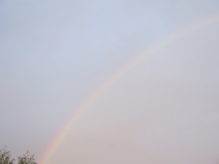 rainbow in the sky above the village house