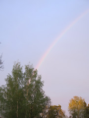 rainbow in the sky above the village house