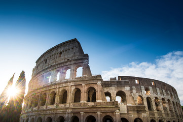 Fototapeta na wymiar The Colosseum or Coliseum at sunrise in Rome Italy