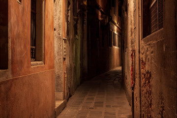 Fototapeta na wymiar Empty streets of Venice at night. Mystic atmospheres both