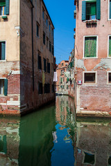 Fototapeta na wymiar Venice canal. Houses on the water