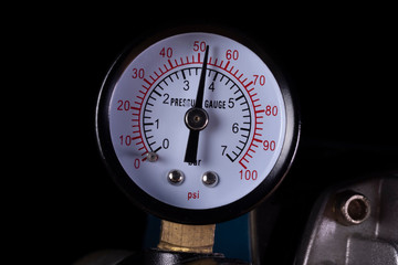 Air compressor manometer close-up. Pressure gauge measurement.