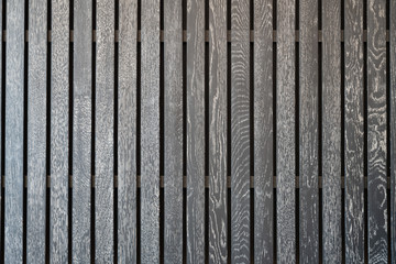 Fototapeta premium Black wooden battens with white scraping burrs. background texture interior design