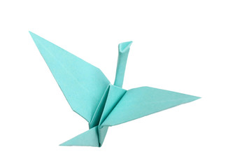 Blue origami bird on white background