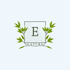 Green eco letters E logo with leaves in square shape. Initials with botanical elements with floral letter design for business identity style
