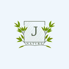 Green eco letters J logo with leaves in square shape. Initials with botanical elements with floral letter design for business identity style