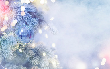 Christmas and New Year holidays background. Christmas tree with light and blurred background