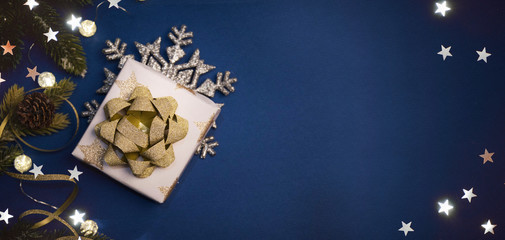 Christmas composition. Gifts, fir tree branches, decorations on holiday background. Christmas, winter, new year concept.