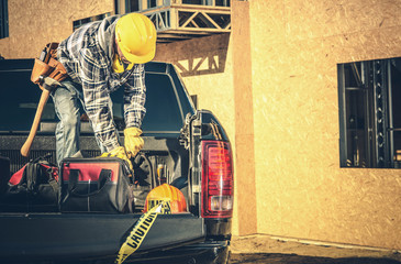 Contractor Cleaning His Pickup Cargo Bed © Tomasz Zajda