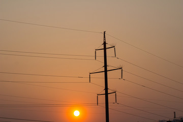 High voltage towers on the sunset time