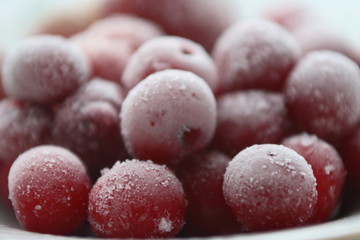 Frozen cherries and strawberries on a white plate