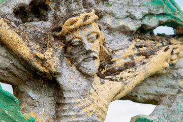 Fragment of very old and antique statue: the suffering of Jesus Christ