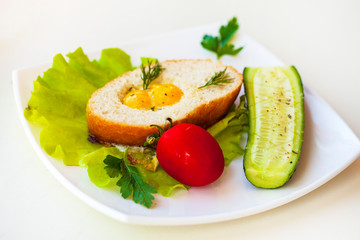 Nutritious vegetarian breakfast, quail eggs in toast with lettuce and vegetables