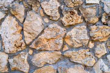 Modern seamless wall made of natural red and white stone, background and texture of old brick walls.