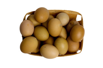 chicken eggs brown eggs in a wicker tray