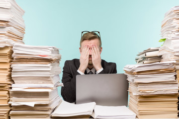 Close-up image of a stressful businessman tired from his work on the foreground