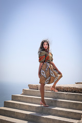 Beautiful girl on the background of a panoramic view of the city of Agadir.