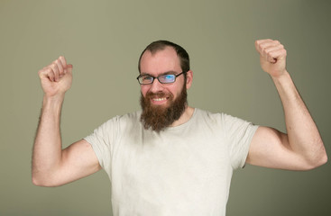 The concept of emotions. Emotions of a man during communication. The man heard the good news, he is...