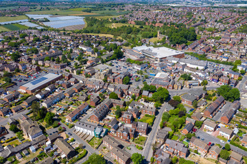 Aerial photo of the town centre of Rothwell in Leeds West Yorkshire in the UK showing typical British housing estates and suburban areas on a sunny summers day