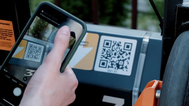 girls uses scooter sharing via smartphone and qr code