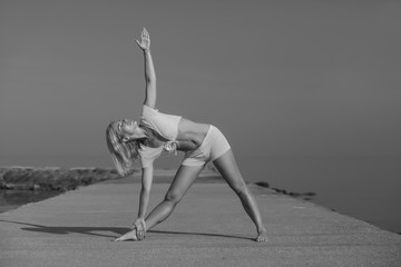 Fototapeta na wymiar young athletic healthy girl doing yoga