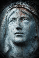 Fototapeta na wymiar Close up ancient statue with cracks: Virgin Mary.