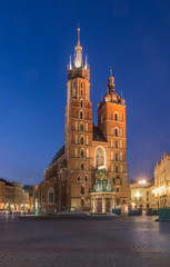 Naklejka na ściany i meble Main market square, St Mary's church in the night, Krakow, Poland