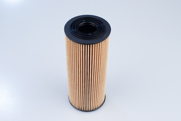 Car oil cartridge filter on a white background.