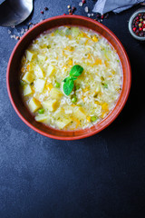 soup vegetables and pasta alphabet, peas, corn Menu concept healthy eating. food background top view copy space for text table setting keto or paleo diet organic