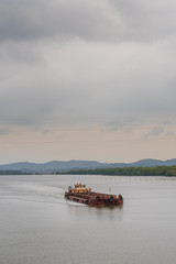 Borim,Goa/India- May 1 2020: Barges carrying mining ore for export at Borim, Goa.