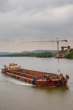 Borim,Goa/India- May 1 2020: Barges carrying mining ore for export at Borim, Goa.
