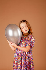 cute girl holding a balloon