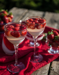 Fresh strawberry jelly on old wooden background. Tasty healthy vegetarian dessert sugar free. 

